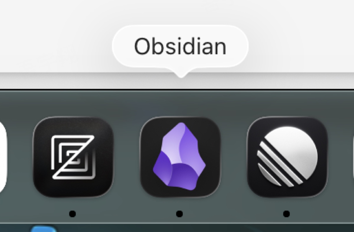 Mac Dock 上的 Obsidian 图标，紫色水晶造型
